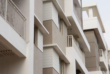 A Set of white concrete apartment buildings 